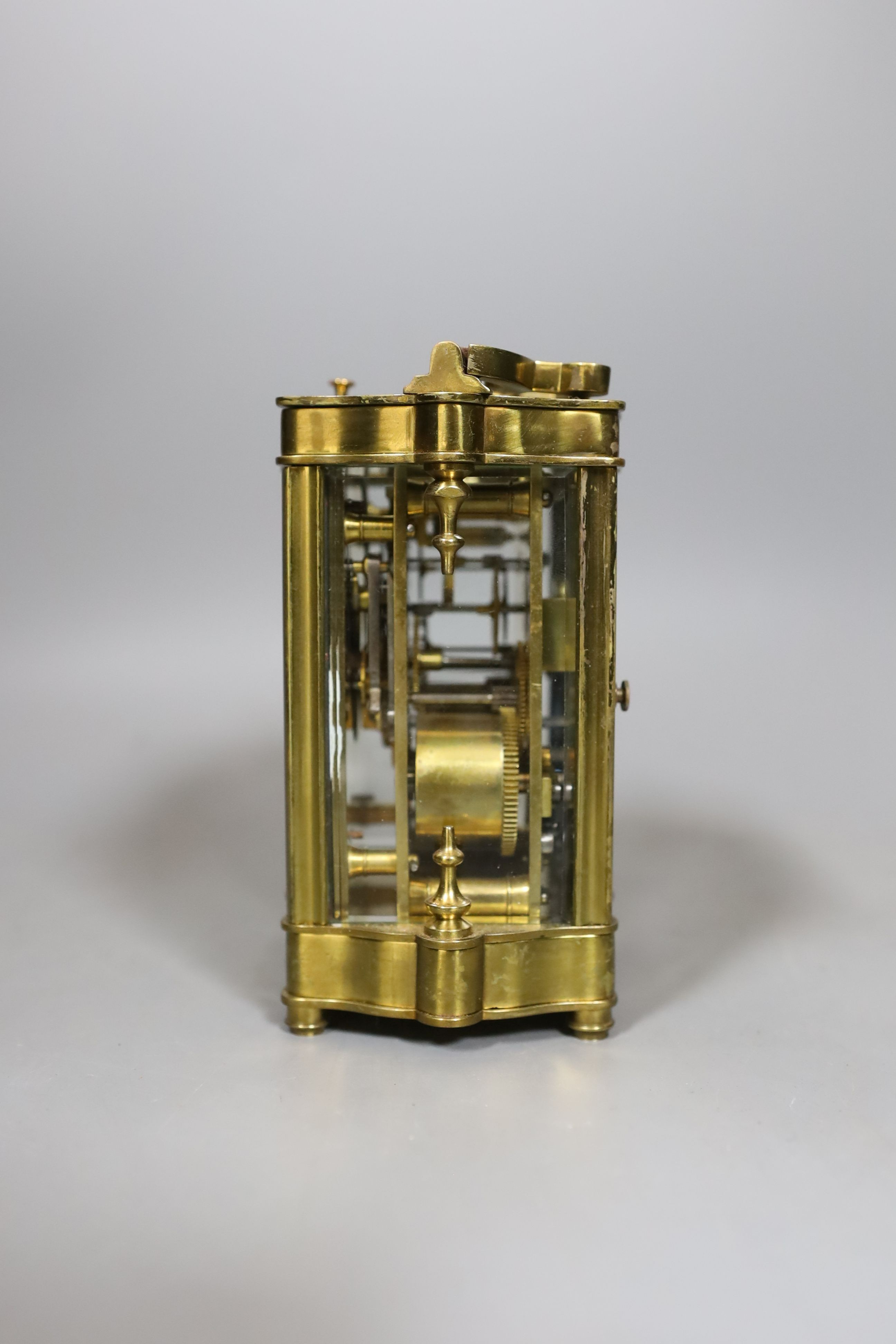 A cased brass repeating carriage clock, in case, 12 cms high.